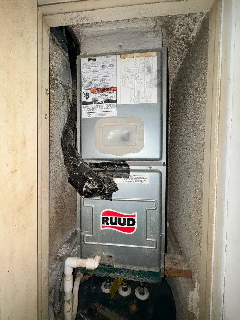 Mechanical closet and water heater area reviewed during the condo sale
