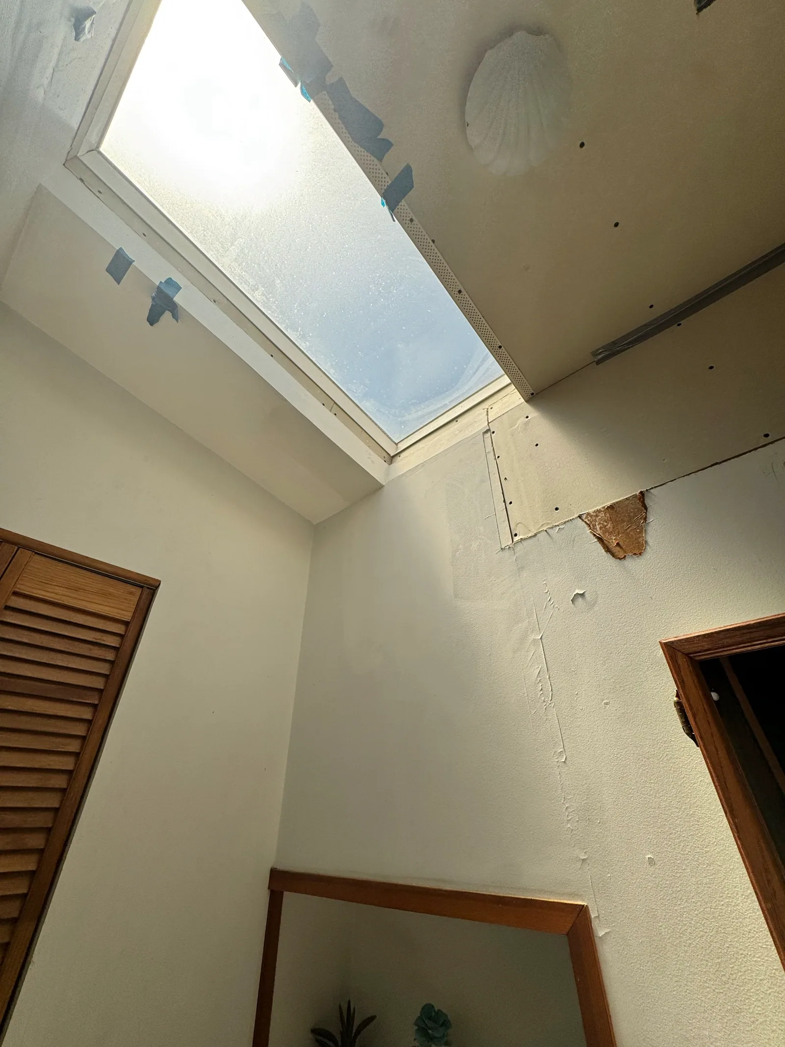 Interior skylight and patched ceiling area included in the repair review