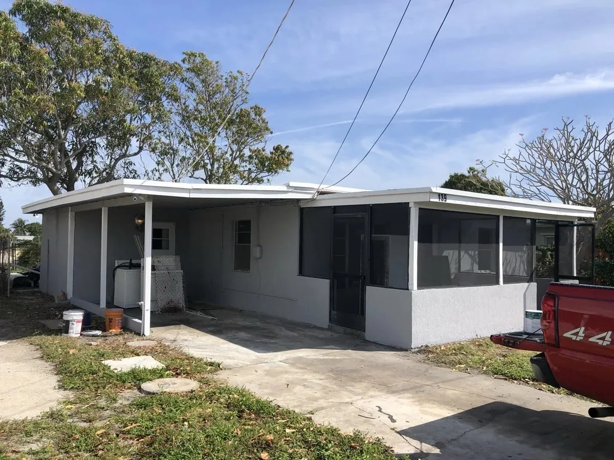 House with visible storm damage in Florida